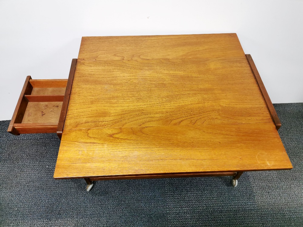 A mid 20thC teak coffee table, together with a further mid century teak drop leaf tea trolley, H. - Image 5 of 5