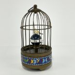 A novelty brass and enamelled birdcage clock, H. 20cm.