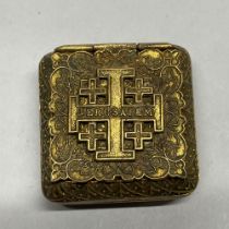 A yellow metal Jerusalem pill box, 4 x 4cm.