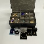 A jewellery box and contents including silver.