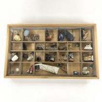 A collector's box of mixed interesting miniature items, case size 51 x 31cm.