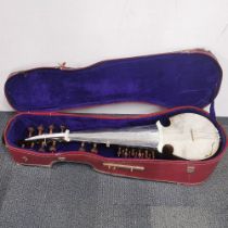 An Amjad Ali Khan style Sarod concert model cased Indian stringed instrument, L. 103cm. A/F to