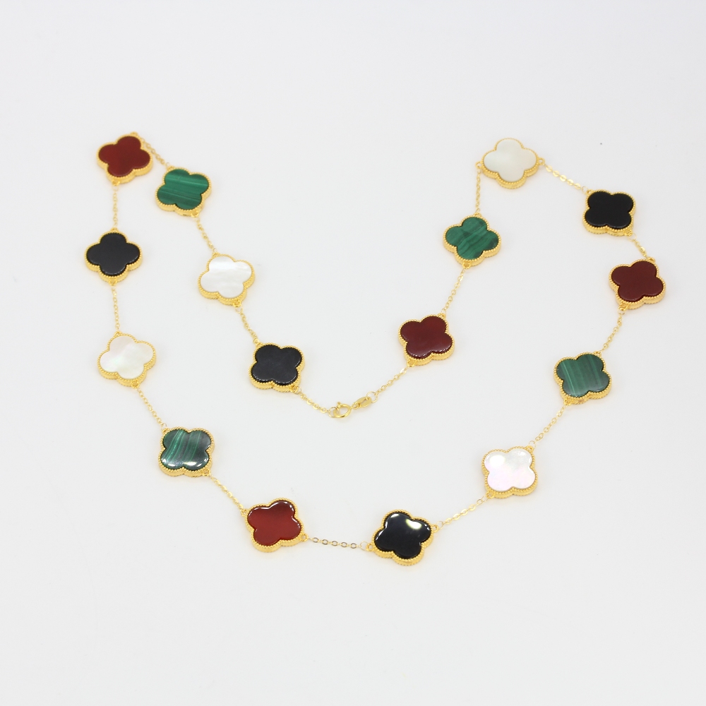 An 18ct yellow gold clover necklace set with malachite, onyx, carnelian and mother of pearl, L. - Image 6 of 6