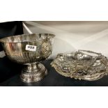 A silver plated punch bowl, basket and a set of shamrock teaspoons.