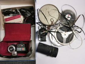 A Minolta camera with lenses and other equipment.