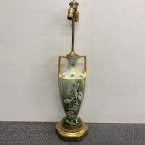 A Continental hand painted porcelain double handled vase mounted as a table lamp H. 85cm.