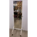 An interesting vintage adjustable dressing mirror on a wheeled metal base, overall H. 168cm.