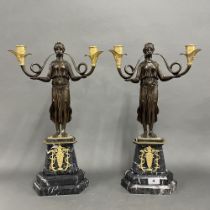 A pair of superb classical bronze and gilt bronze figural candelabra on grey marble bases. H. 52