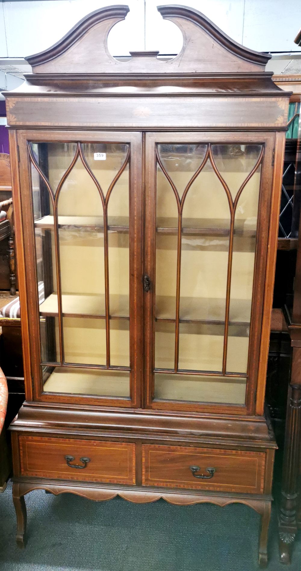 An inlaid mahogany display cabinet with two bottom drawers, 195 x 100 x 35cm.