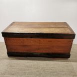 A vintage stained pine chest/ trunk, missing one iron handle, 108 x 52 x 50cm.