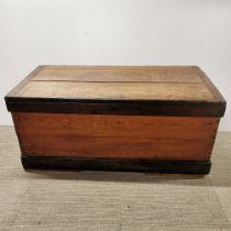 A vintage stained pine chest/ trunk, missing one iron handle, 108 x 52 x 50cm.