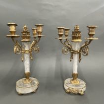 A pair of gilt bronze and rock crystal candelabra, H. 37cm, one sconce missing.