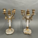 A pair of gilt bronze and rock crystal candelabra, H. 37cm, one sconce missing.