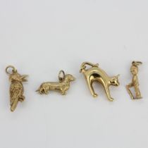 A mixed group of four 9ct yellow gold pendants, longest L. 2.8cm.