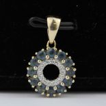 A 10ct yellow gold (stamped 10K) pendant set with London blue topaz and diamonds, L. 2cm.