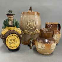 A Royal Doulton stoneware gin barrel. Together with two further Doulton jugs and pottery sherry jug.