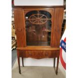 A glass fronted early 20thC carved single drawer walnut veneered display cabinet, 162 x 102 x 35cm.