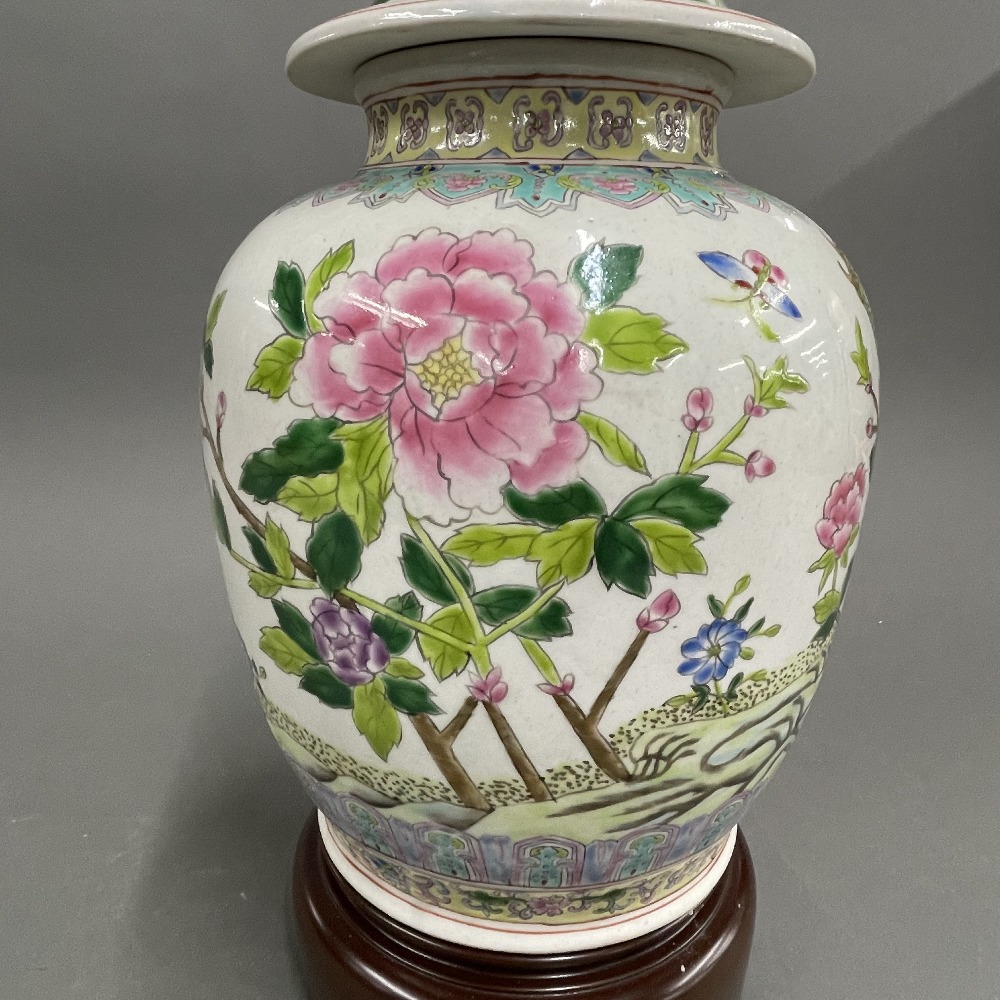 A Chinese hand painted porcelain jar and cover mounted as a lamp base on a wooden stand, H. 55cm. - Image 2 of 4