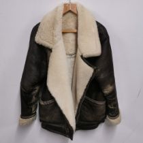 A leather and sheepskin flying jacket by Milan leatherware, size s.