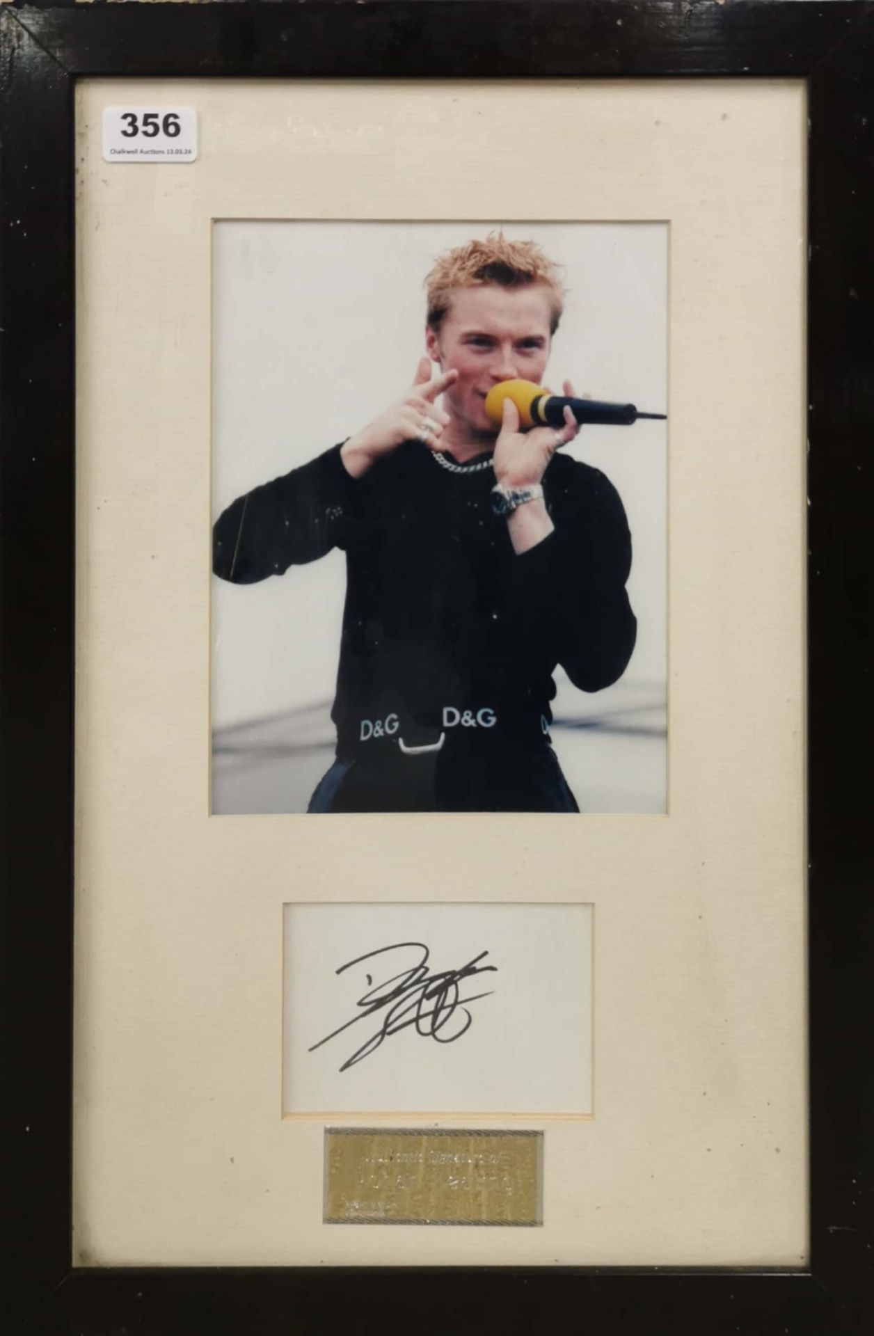 A framed photograph and autograph, signed by Ronan Keating with certificate of authenticity for