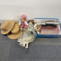 Two vintage dolls, record rack and two straw hats.