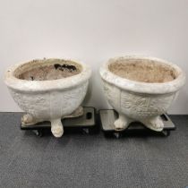 A pair of very large antique cast concrete garden planters raised on four feet, H. 45cm Dia. 60cm.