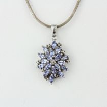 A 925 silver pendant set with marquise cut tanzanites on a silver chain, L. 51cm.