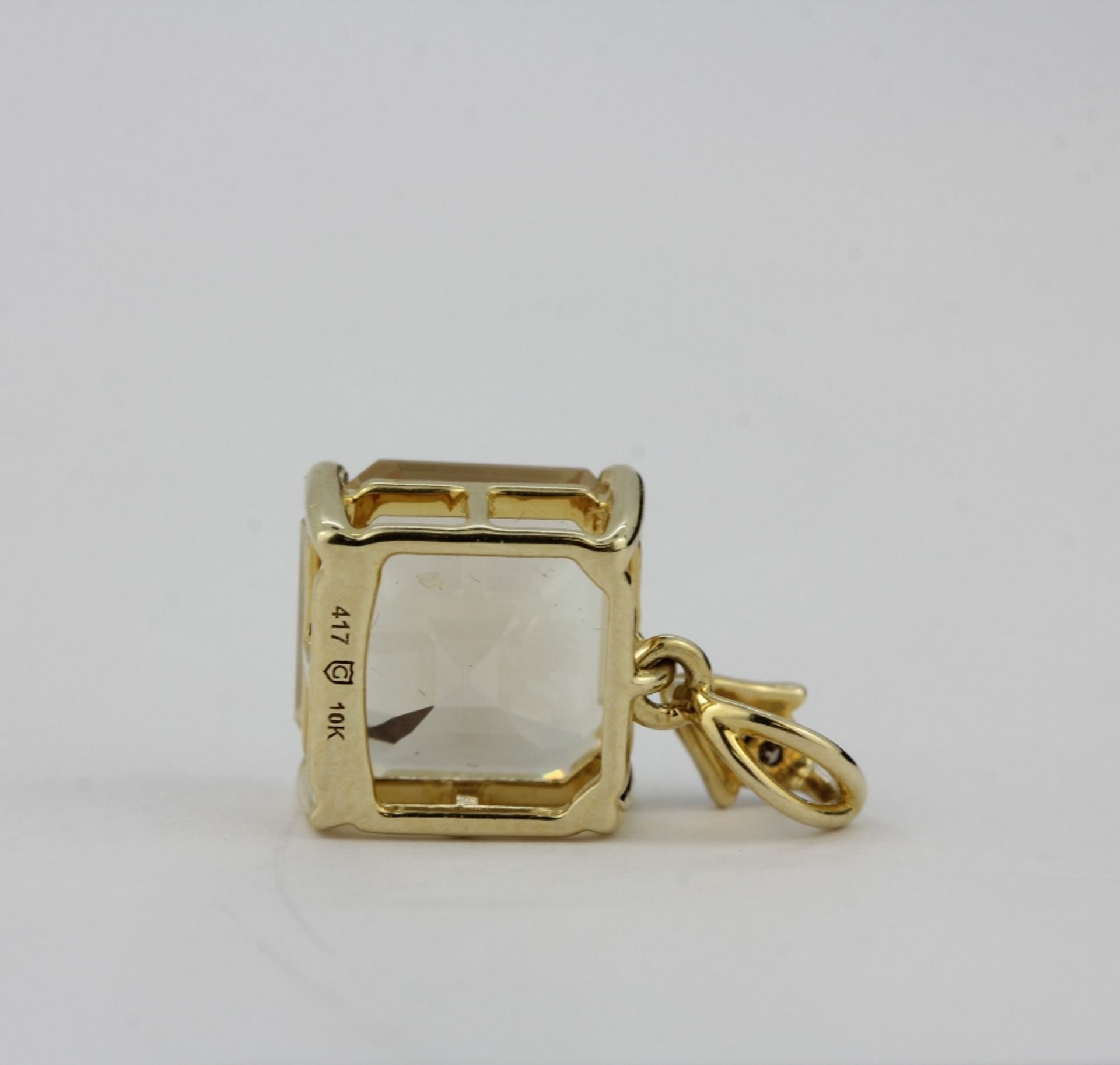 A 10ct yellow gold (stamped 10K) pendant set with an emerald cut lemon quartz and diamonds, L. 1. - Image 3 of 3