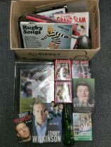 A quantity of rugby related collectibles.