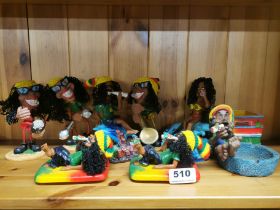 A group of resin Rastafarian figures.