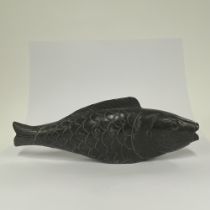 A carved black marble model of a Koi Carp, L. 49cm. Tiny chip to tail.