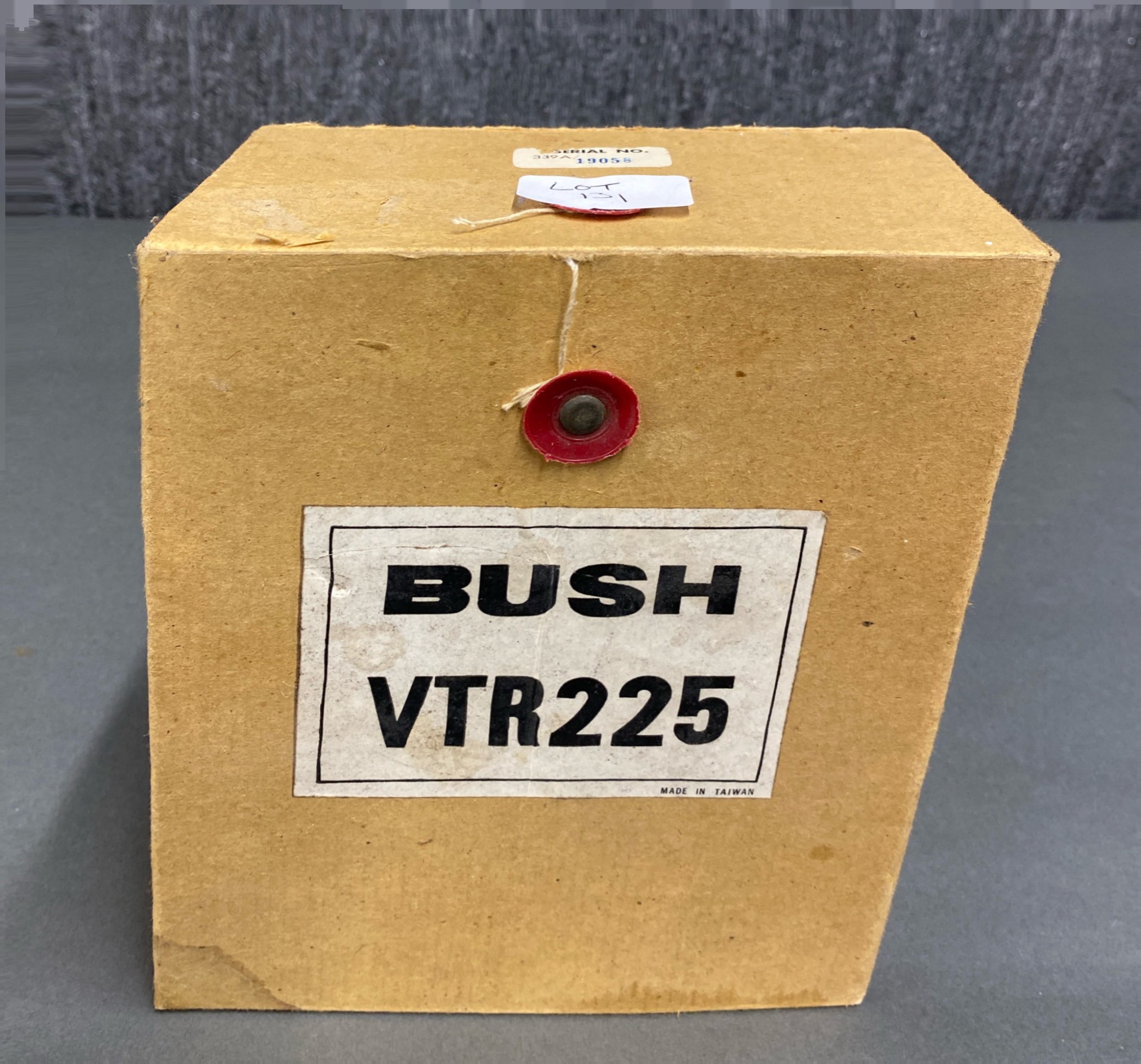 A boxed Bush VTR225 portable transistor radio.