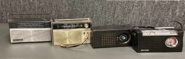 A group of four solid state transistor radios including Bush, Alba , Ekco PT306 and Vega.