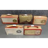A group of five portable transistor radios including a Pye radio, Stella a Colster-Brandes, an Ek