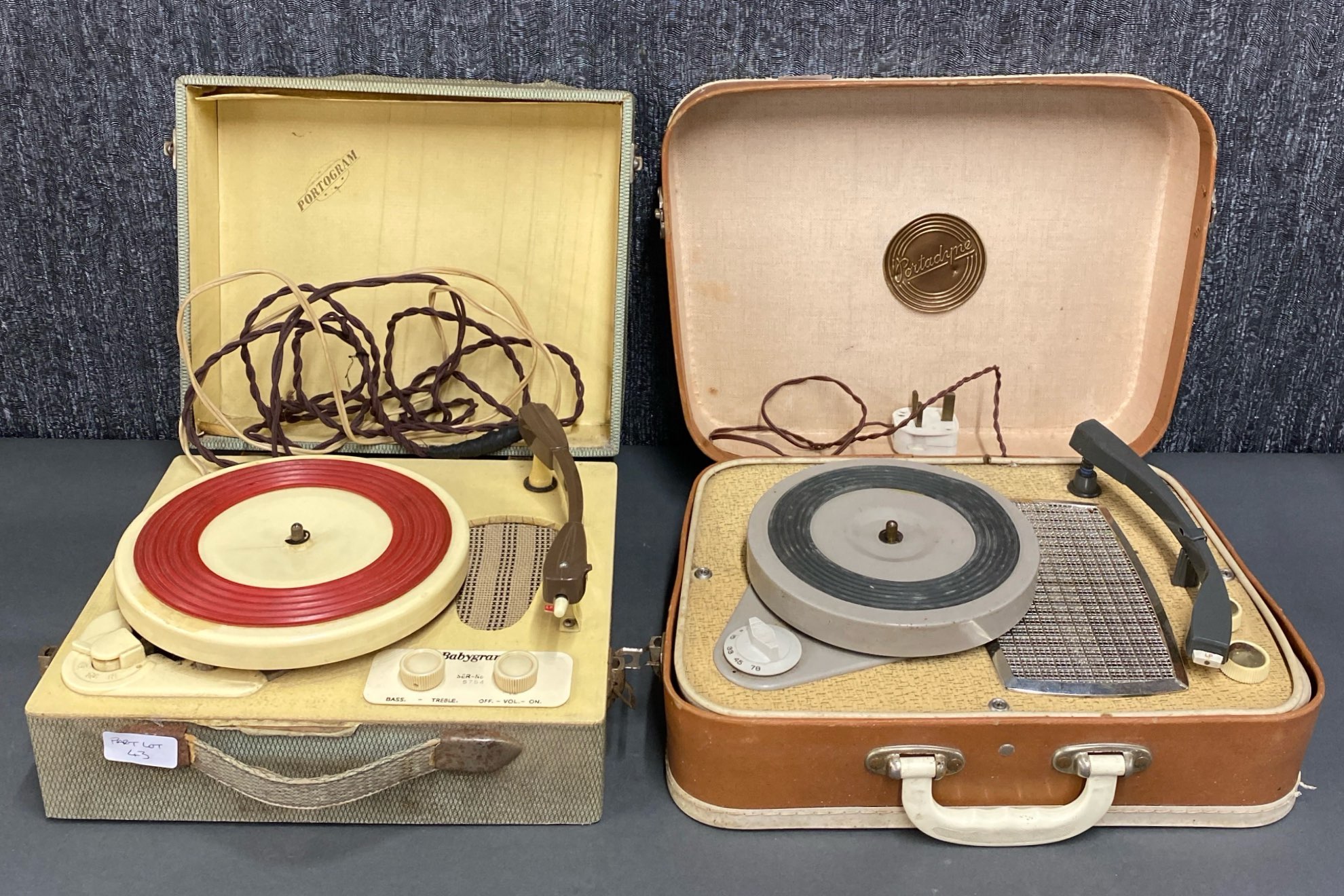 A cased Portandyne together with a cased Portagram serial number 5754, portable record players.