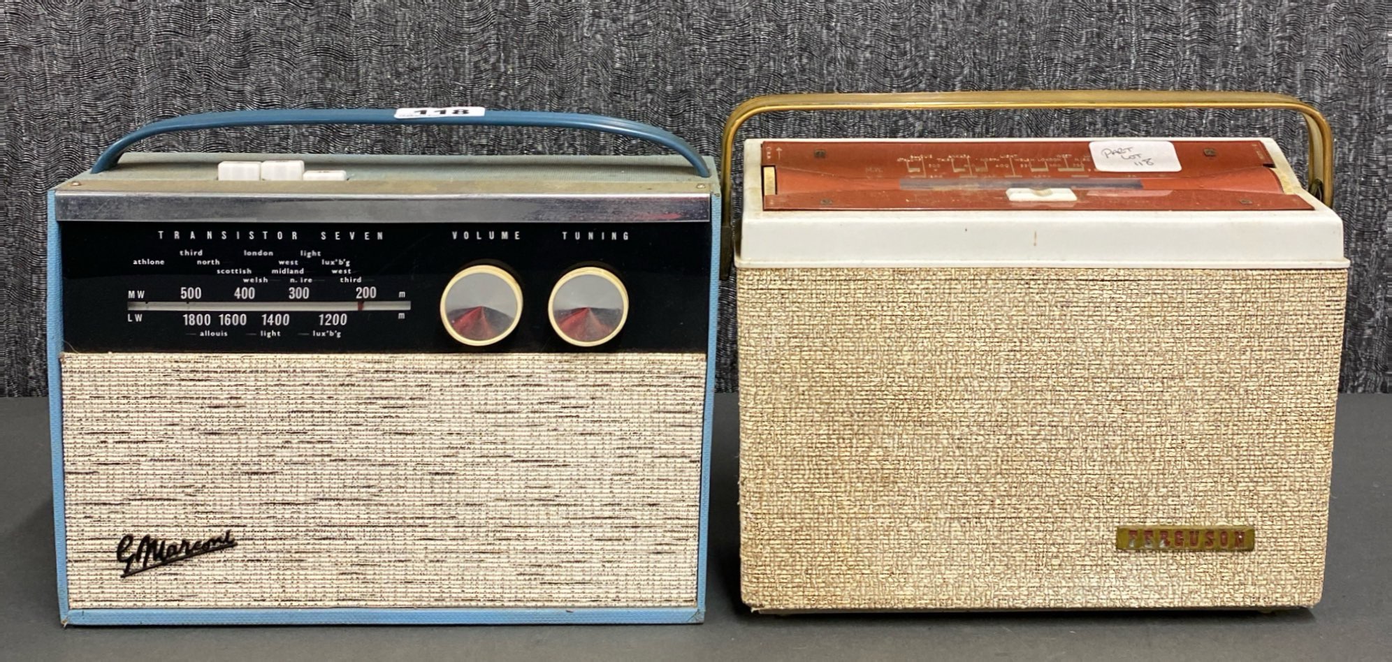 A group of two portable transistor radios including G.Marconi and a Ferguson.