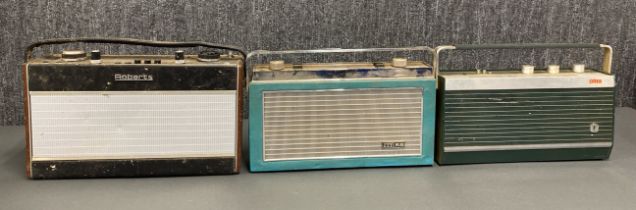 A group of three vintage solid state radios, including a Roberts R707, an ultra and an ITT KB.