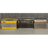 A group of three early solid state transistor radios, including a Pye Typhoon, a Roberts RIC2 and