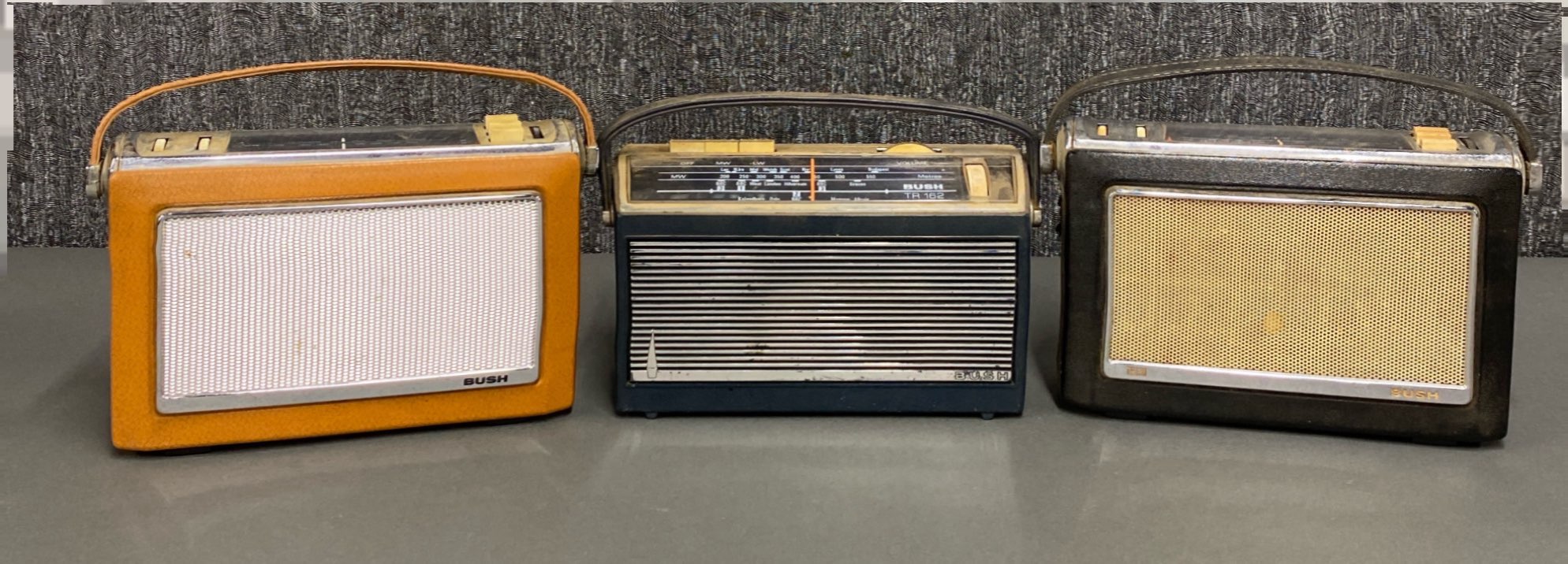 A group of three early Bush transistor radios, model numbers TR130, TR162 & TR230.