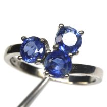 A 925 silver ring set with round cut sapphires, ring size N.