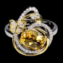 A gold on 925 silver ring set with oval cut citrines and white stones, ring size N.5.