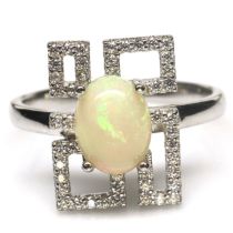 A 925 silver ring set with a cabochon cut opal and white stones, L. 1.6cm, ring size N.5.