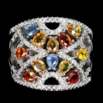 A 925 silver ring set with sapphires and fancy colour sapphires, ring size N.