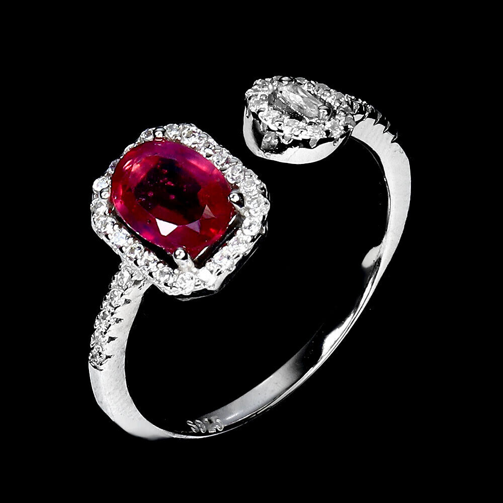 A 925 silver ring set with an oval cut ruby and white stones, ring size N. - Image 2 of 3