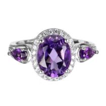 A matching 925 silver ring set with oval cut amethysts and white stones, ring size N.5.