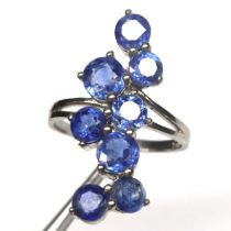 A 925 silver ring set with round cut sapphires, ring size O.