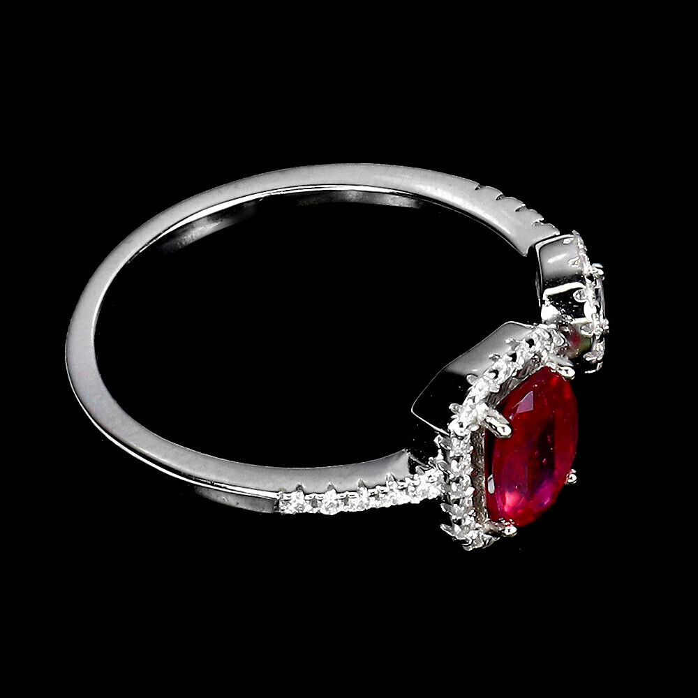 A 925 silver ring set with an oval cut ruby and white stones, ring size N. - Image 3 of 3