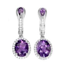 A pair of 925 silver drop earrings set with oval cut amethysts and white stones, L. 2.4cm.