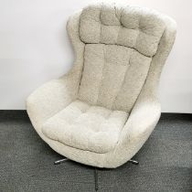 A mid 20thC button backed Parker Knoll style statesman rocking chair, H. 105cm.