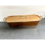 A heavy copper fish pan, W. 88cm.